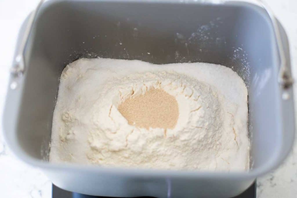 The dry ingredients in the bread machine bread pan, the yeast is in a well in the center.