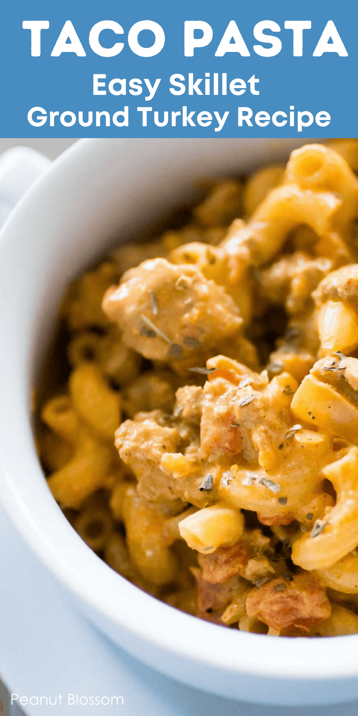 The finished taco pasta skillet recipe has been served in a white bowl.