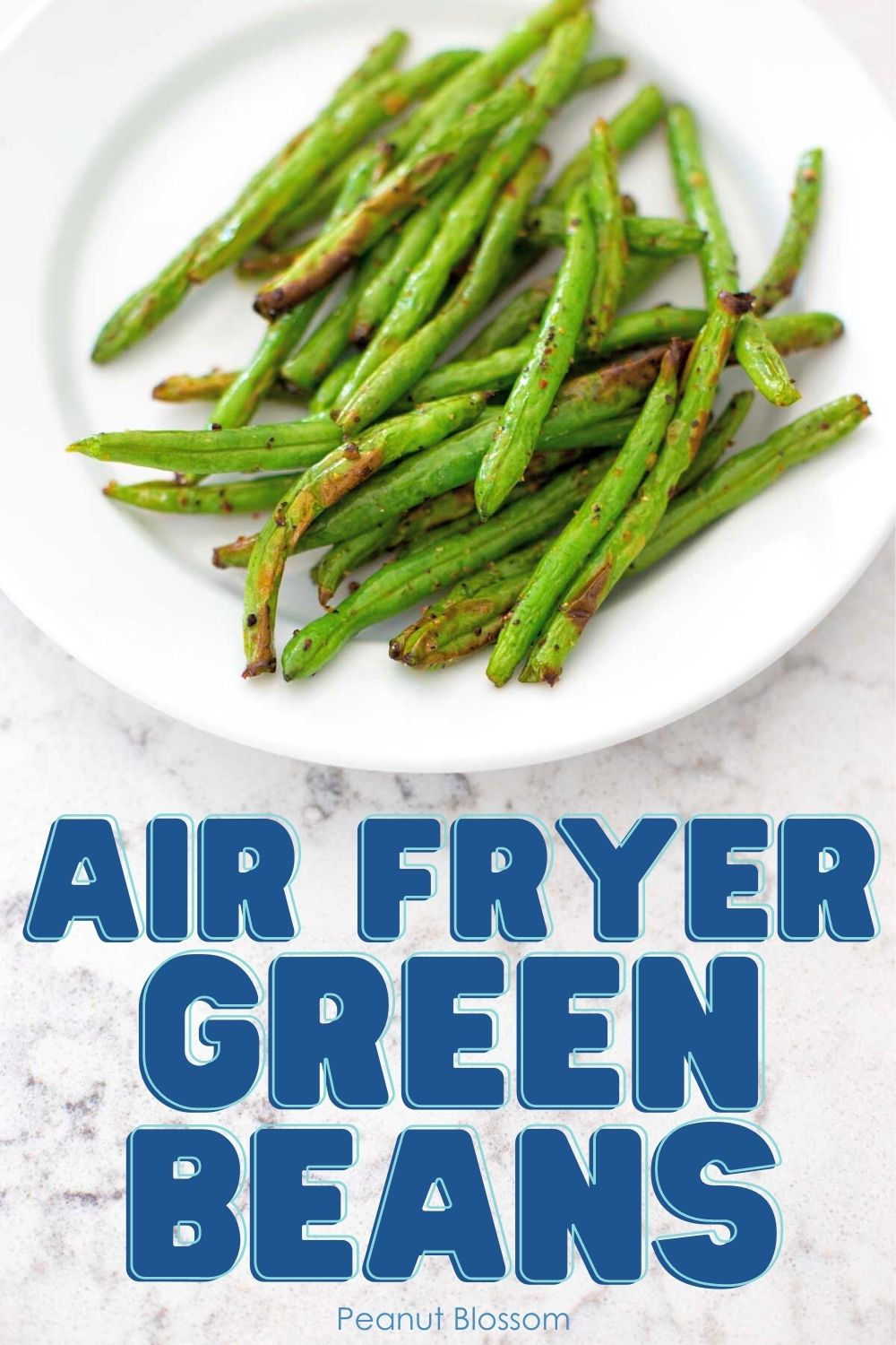 A plate of air fryer green beans that have been cooked.