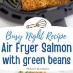 The salmon is shown cooking in an air fryer basket with green beans.