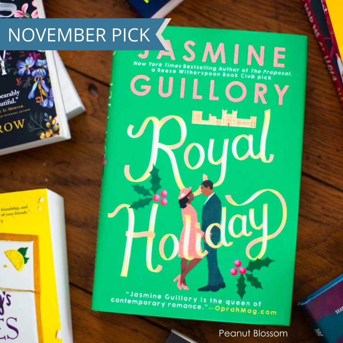 The book Royal Holiday by Jasmine Guillory sits on a table.