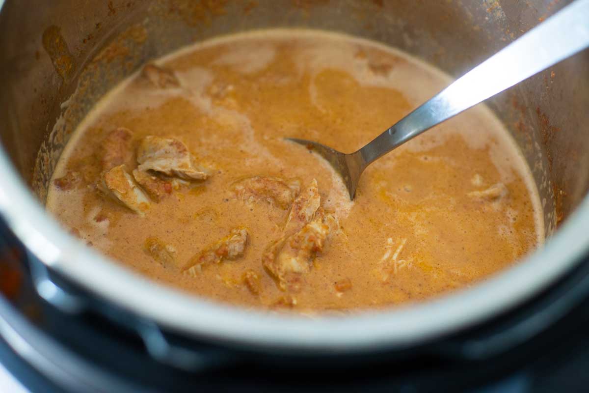 The finished butter chicken sauce is ready for serving in the Instant Pot.