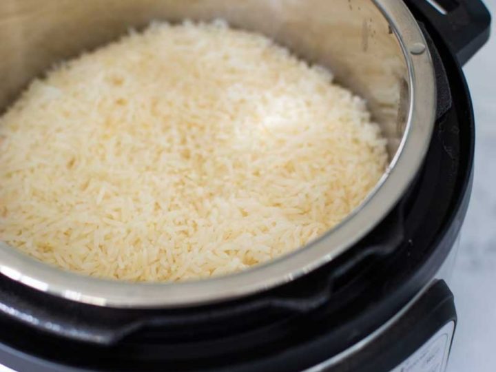 Instant Pot is filled with cooked white jasmine rice.