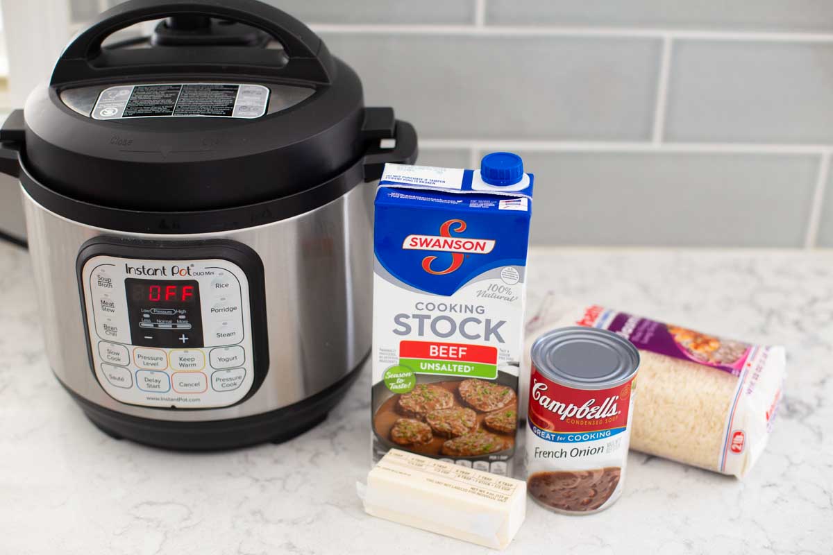 The ingredients for the Instant Pot sticky butter rice are on the counter next to the Instant Pot.