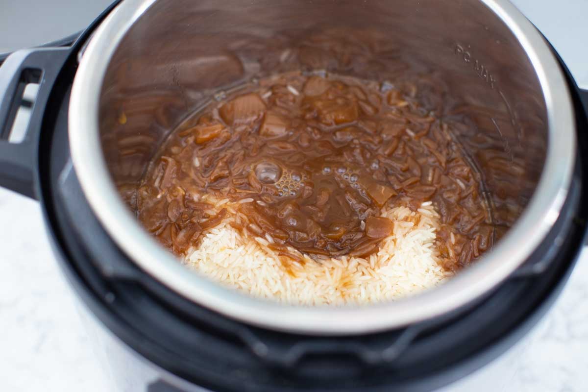 The rice and french onion soup have been added to the Instant Pot.
