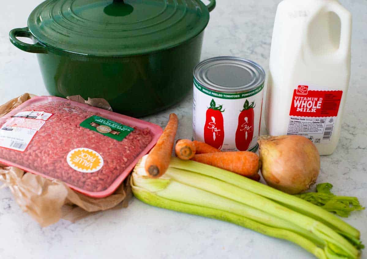 The ingredients to make a big batch of bologonese sauce is on the counter.