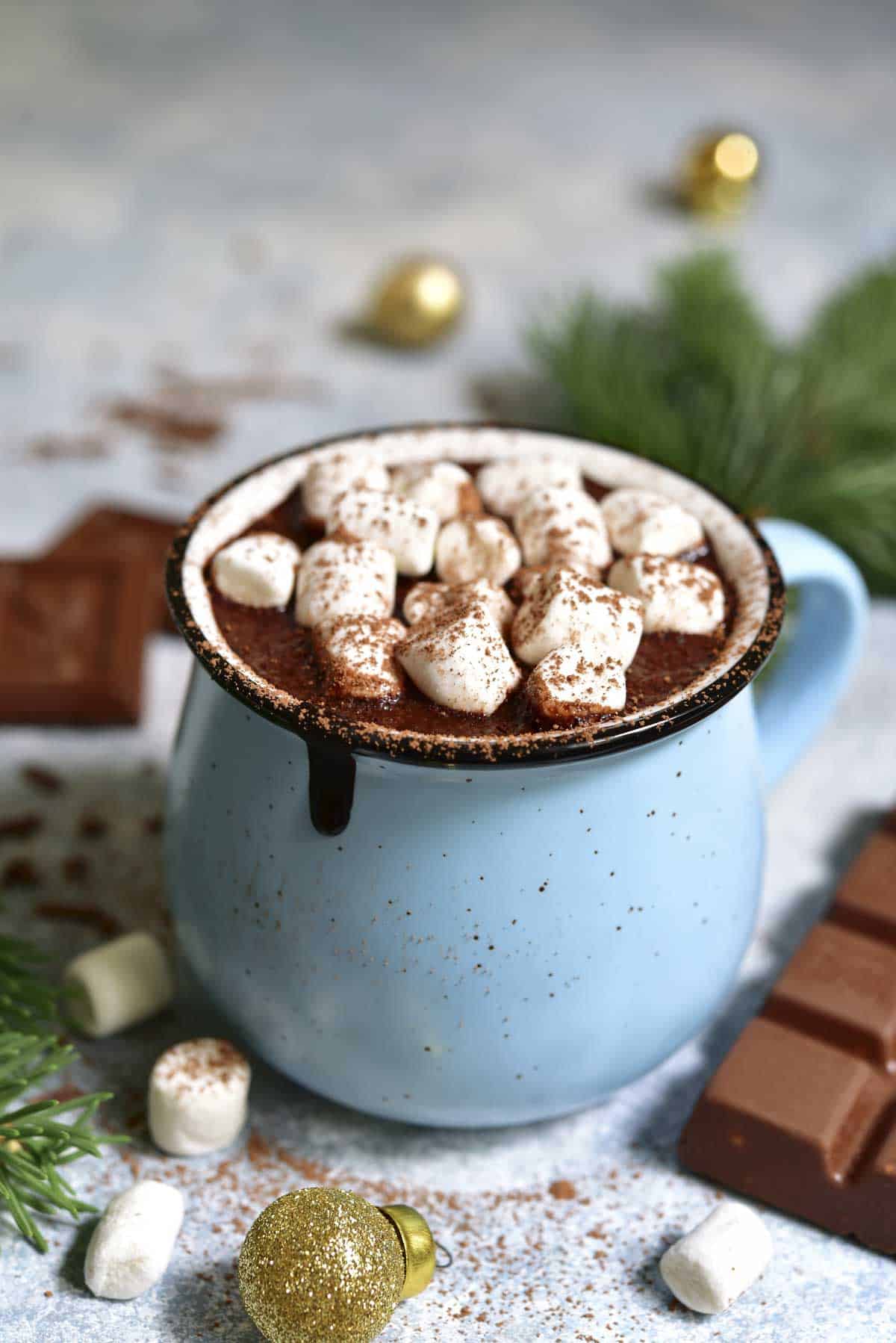 Homemade festive hot chocolate in a blue vintage cup.