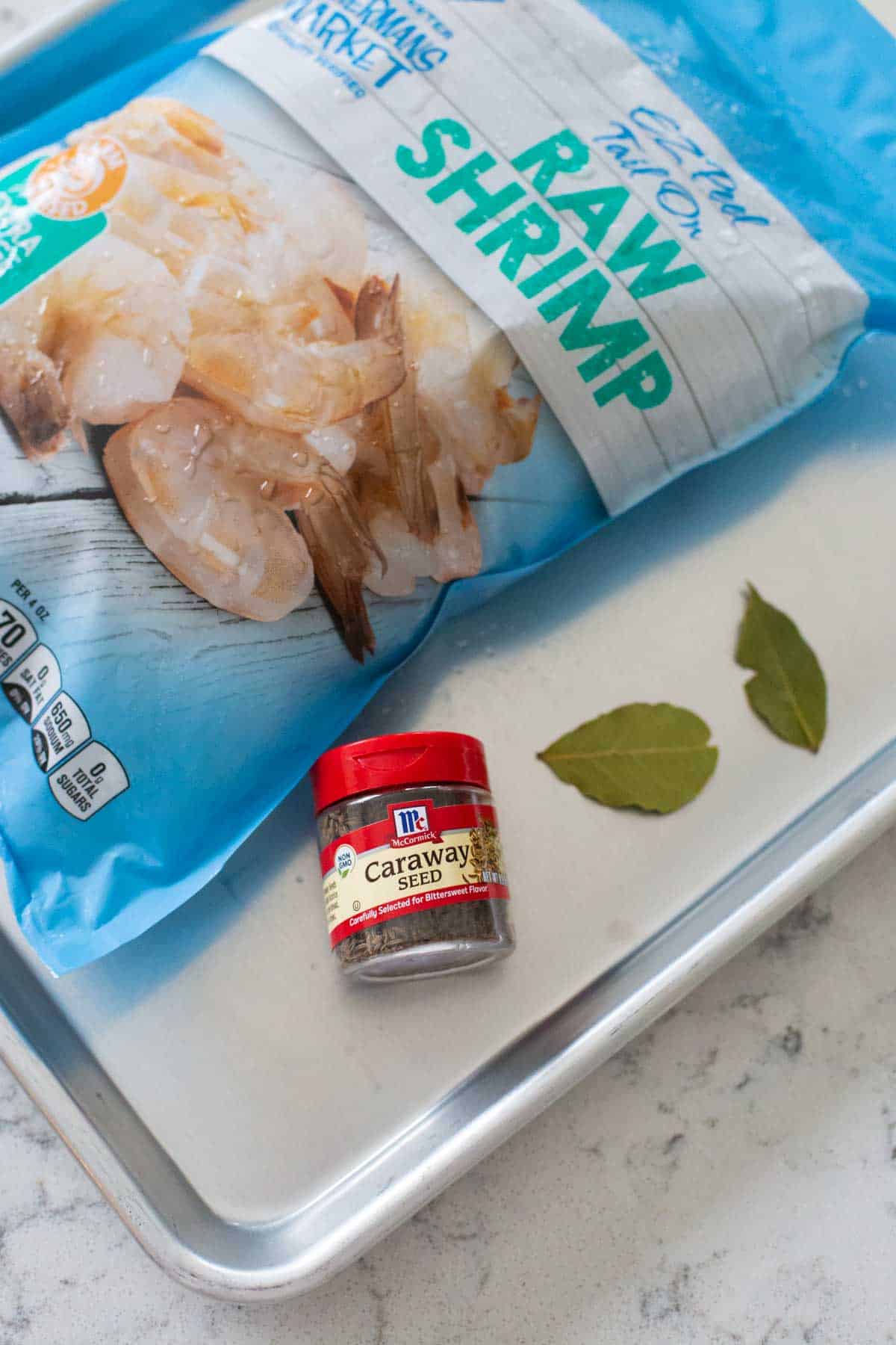 The ingredients to make boiled shrimp are on the counter.