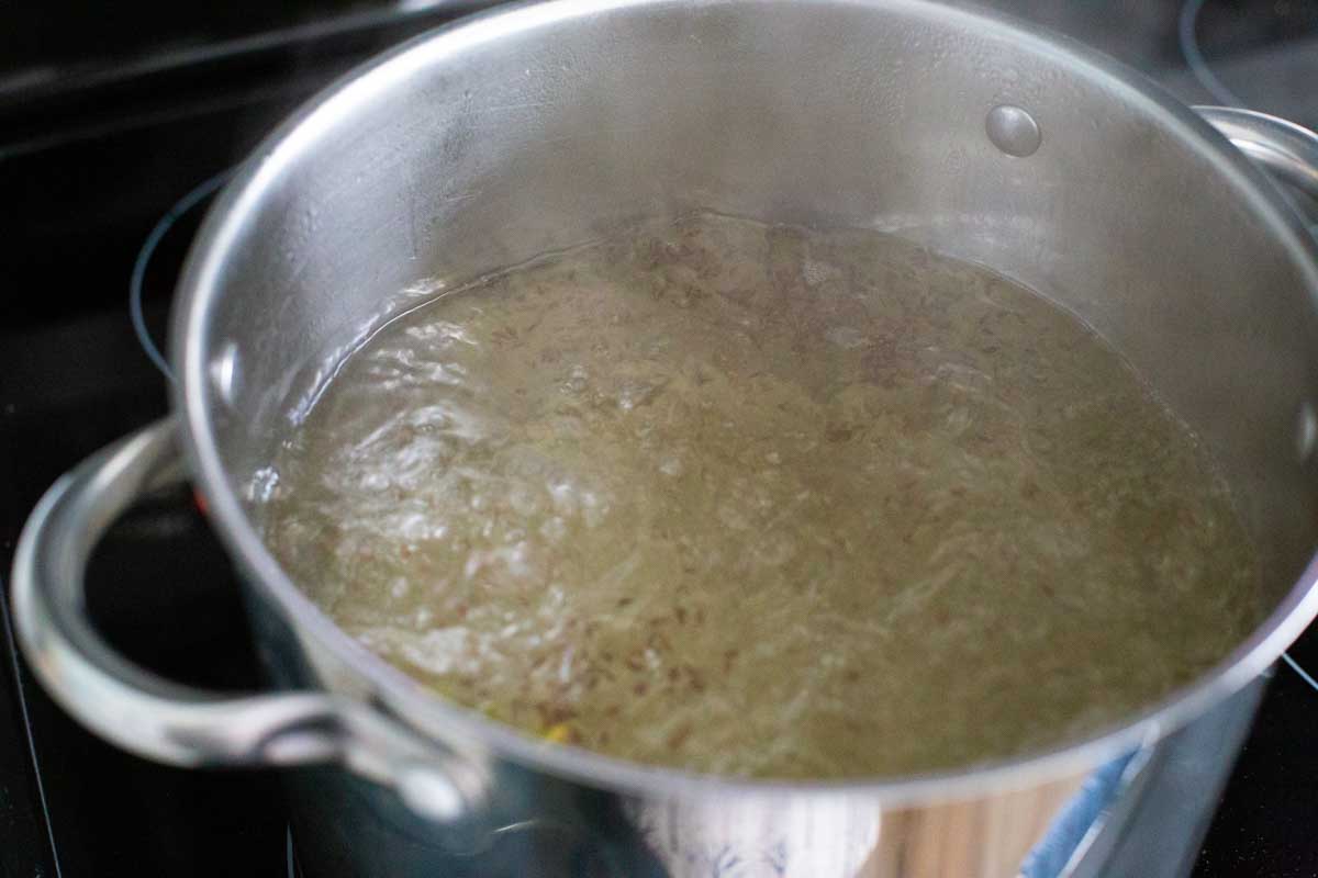 The picture shows how hard the water should be boiling before adding the shrimp.