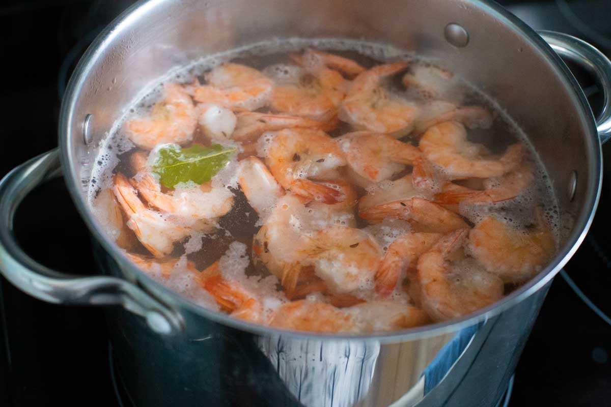 The shrimp are floating at the top of the boiling water.