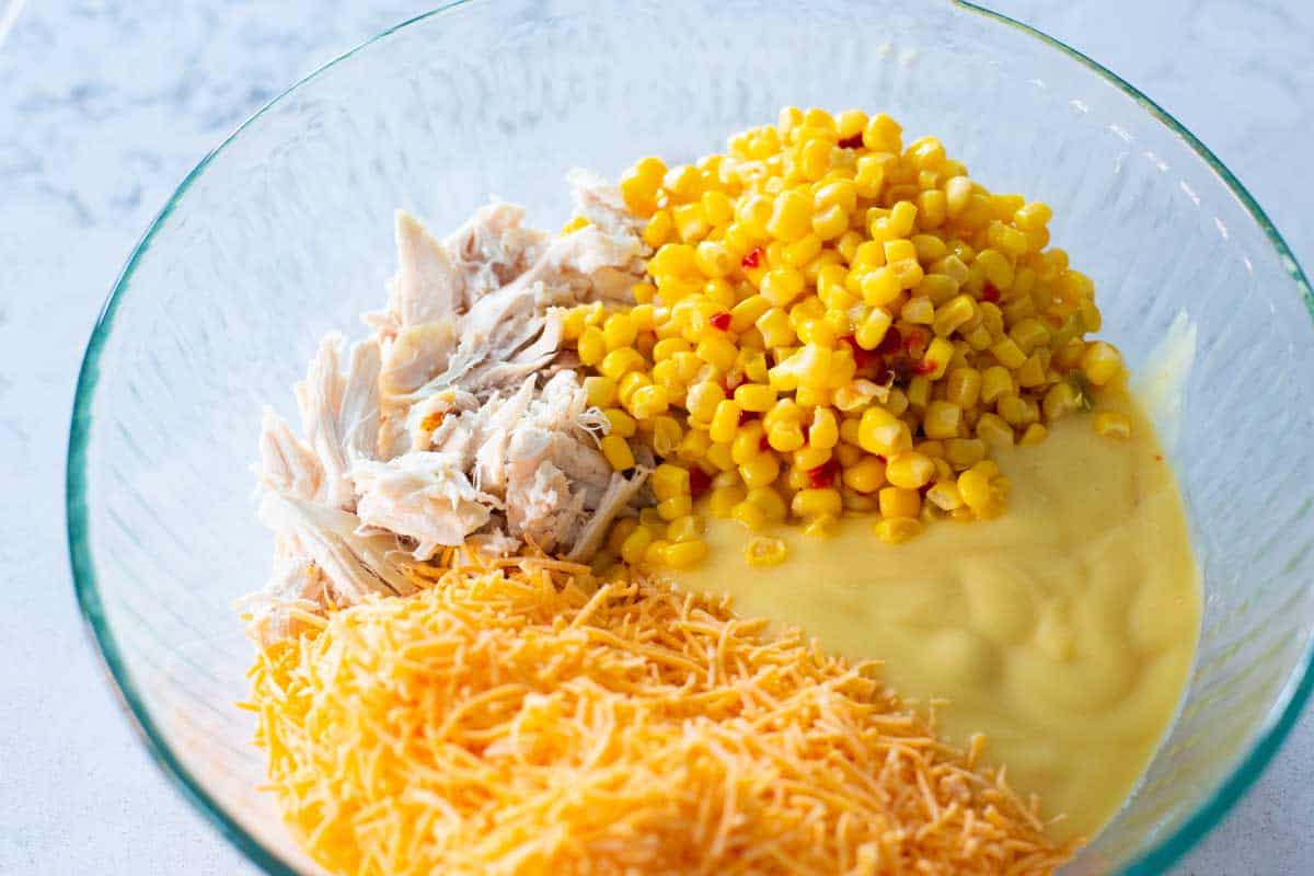 The prepped ingredients are in a large mixing bowl ready to stir together the casserole filling.