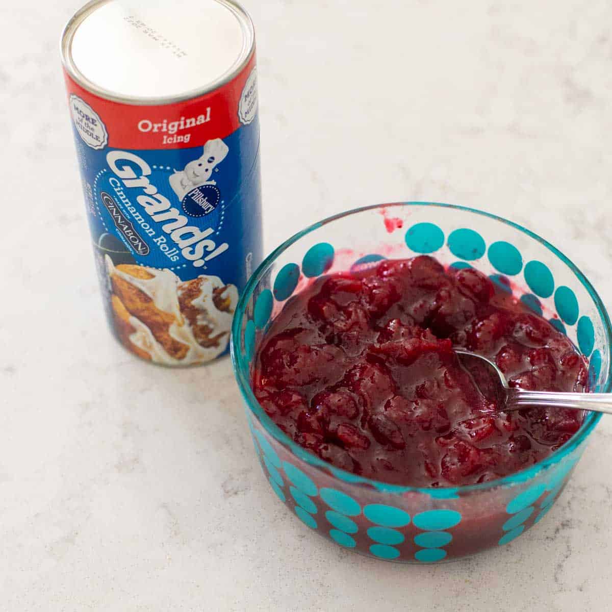 The easy ingredients to make cranberry cinnamon rolls are on the counter.