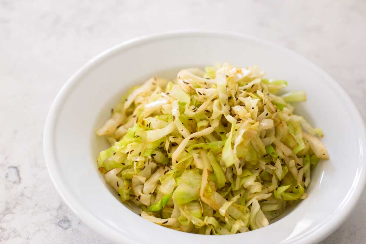 The serving bowl has the fried cabbage ready for dinner.