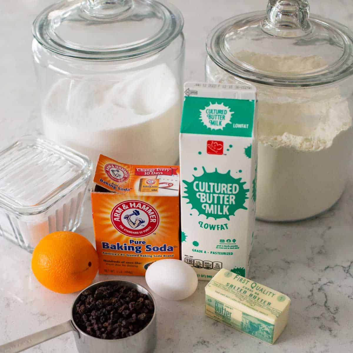 The ingredients to make traditional Irish soda bread in the oven are on the counter.