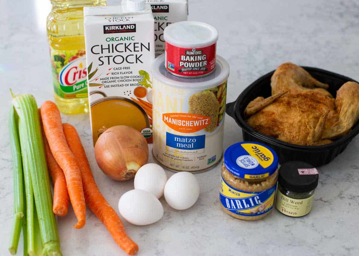 The ingredients to make a homemade matzoh ball soup are on the counter.