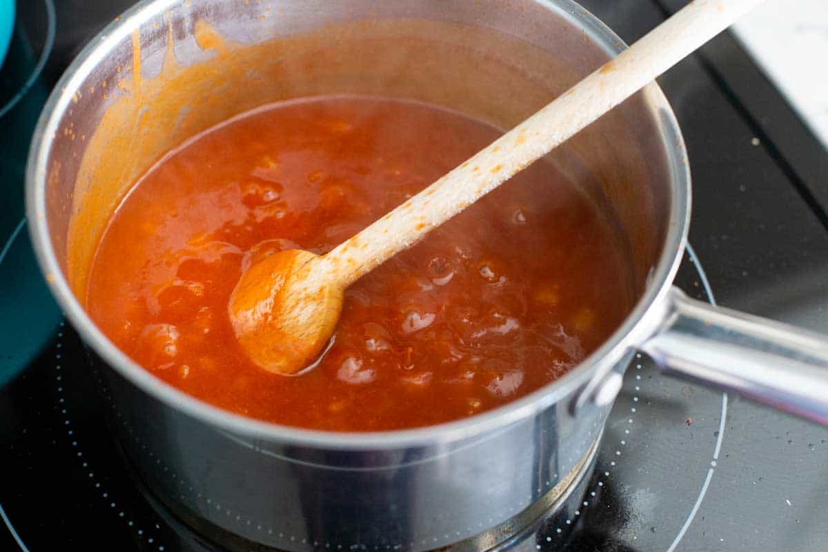 The skillet is bubbling and the BBQ sauce is thickened.