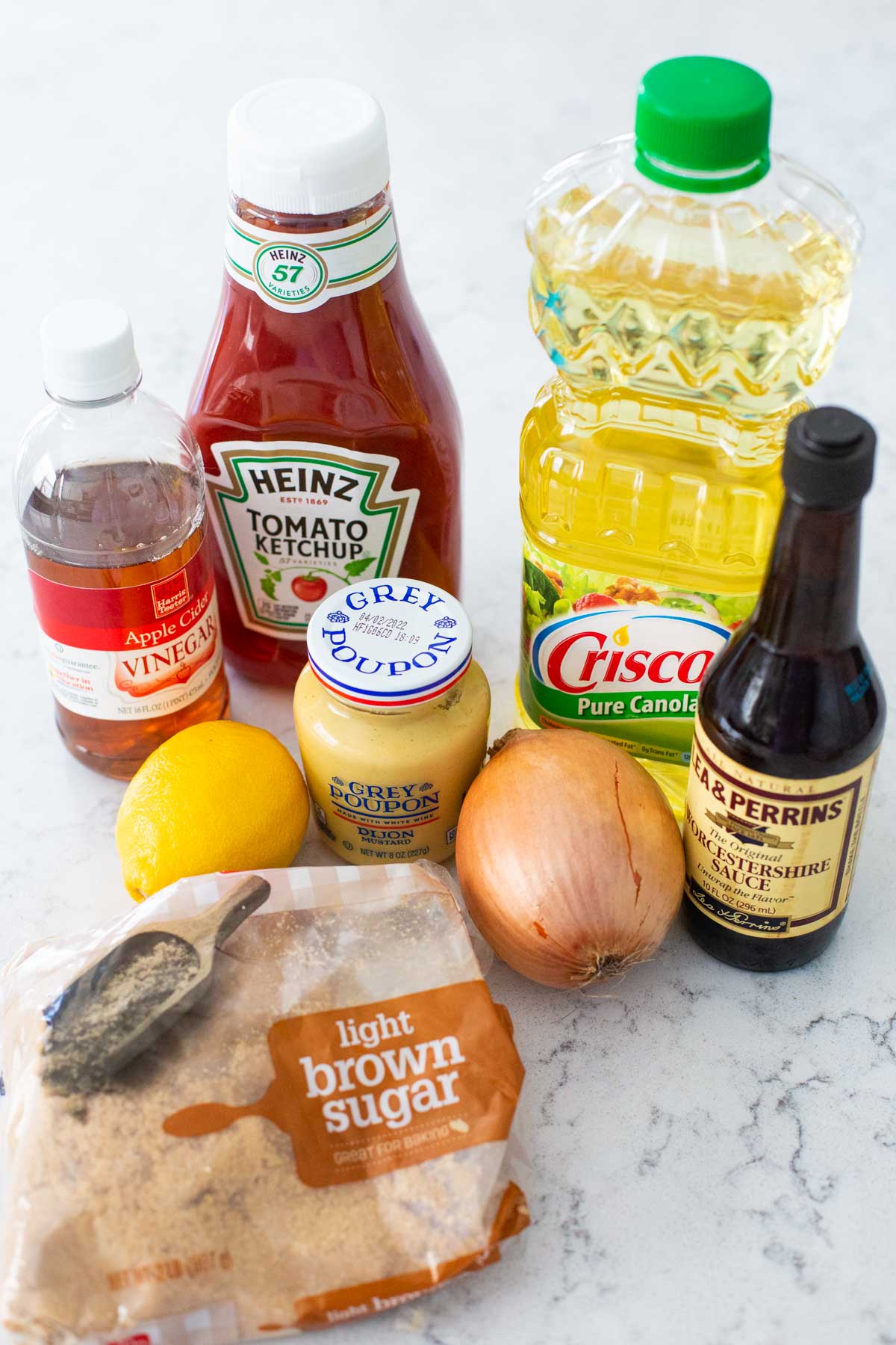 The ingredients to make homemade BBQ sauce are on the counter.