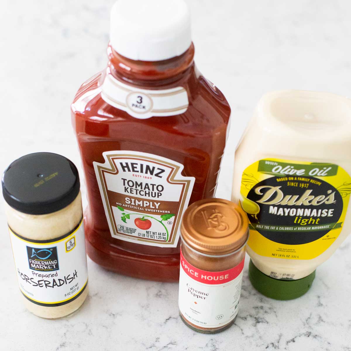 The ingredients to make homemade spicy sauce is on the counter.