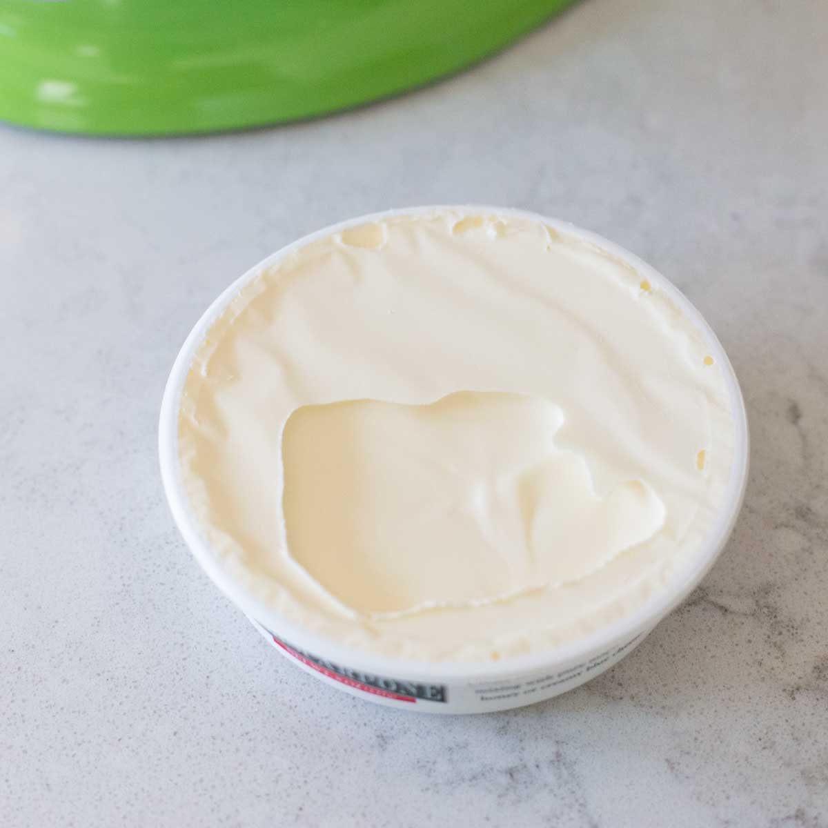 A closer look at creamy mascarpone cheese for a homemade tiramisu.