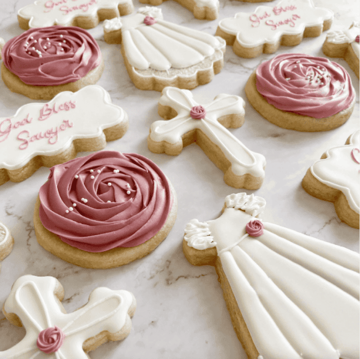 A large rose cookie mimics the tiny rose on a First Communion dress cookie.