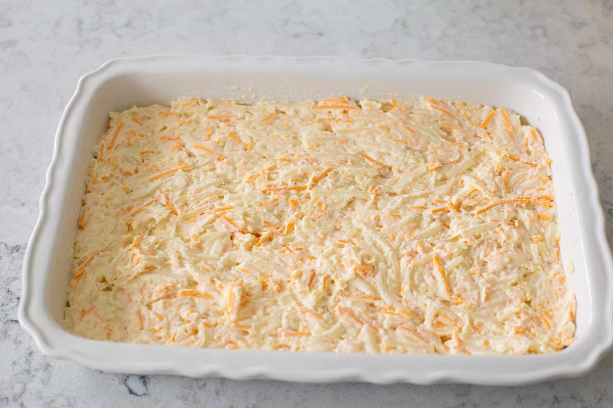 The potatoes have been spread in a 9 x 13 baking dish in an even layer.