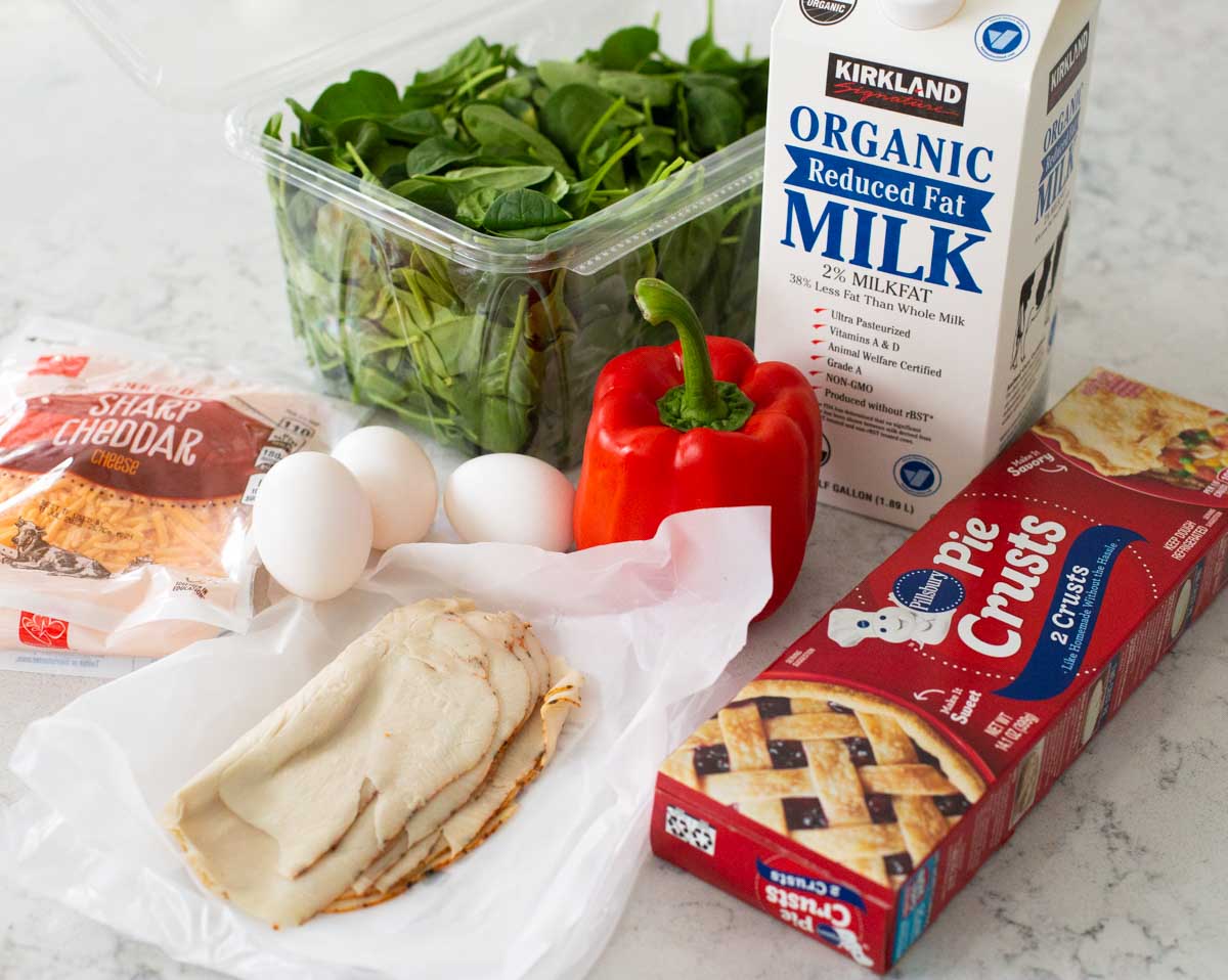 The ingredients to make a simple quiche are on the counter.