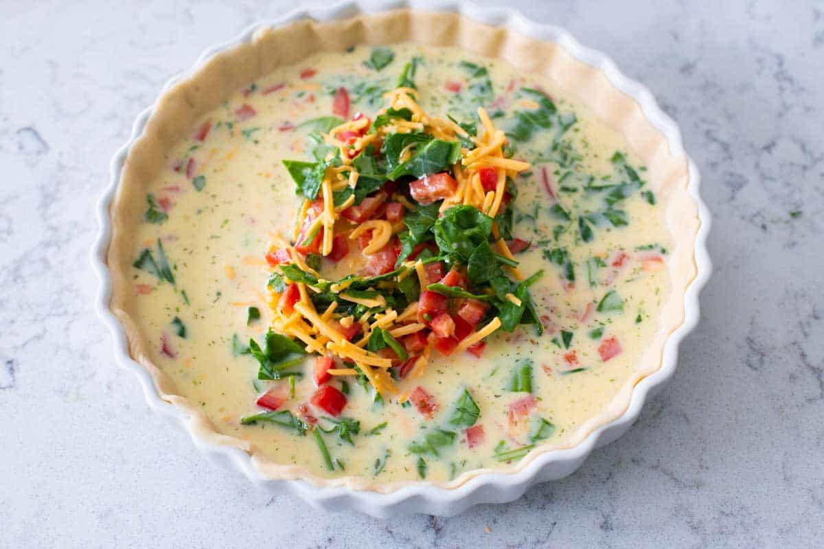 The egg filling has been poured into the pie crust. 