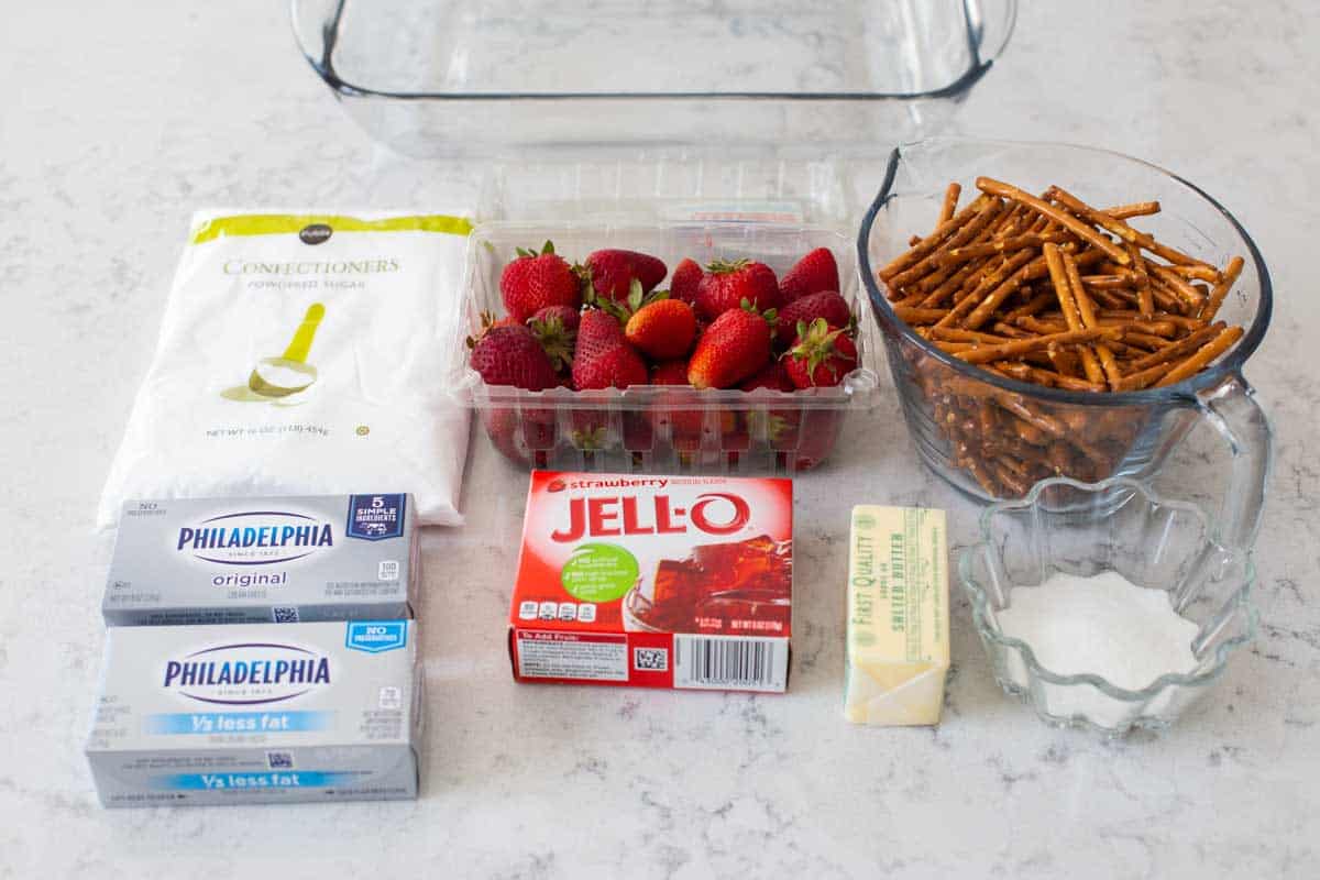 The ingredients for strawberry pretzel salad are on the counter.