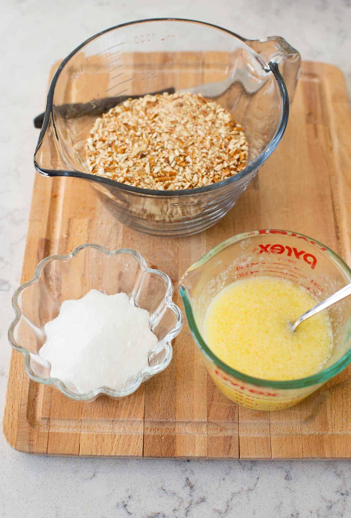 The crushed pretzels, sugar, and butter are ready to be made into crust.