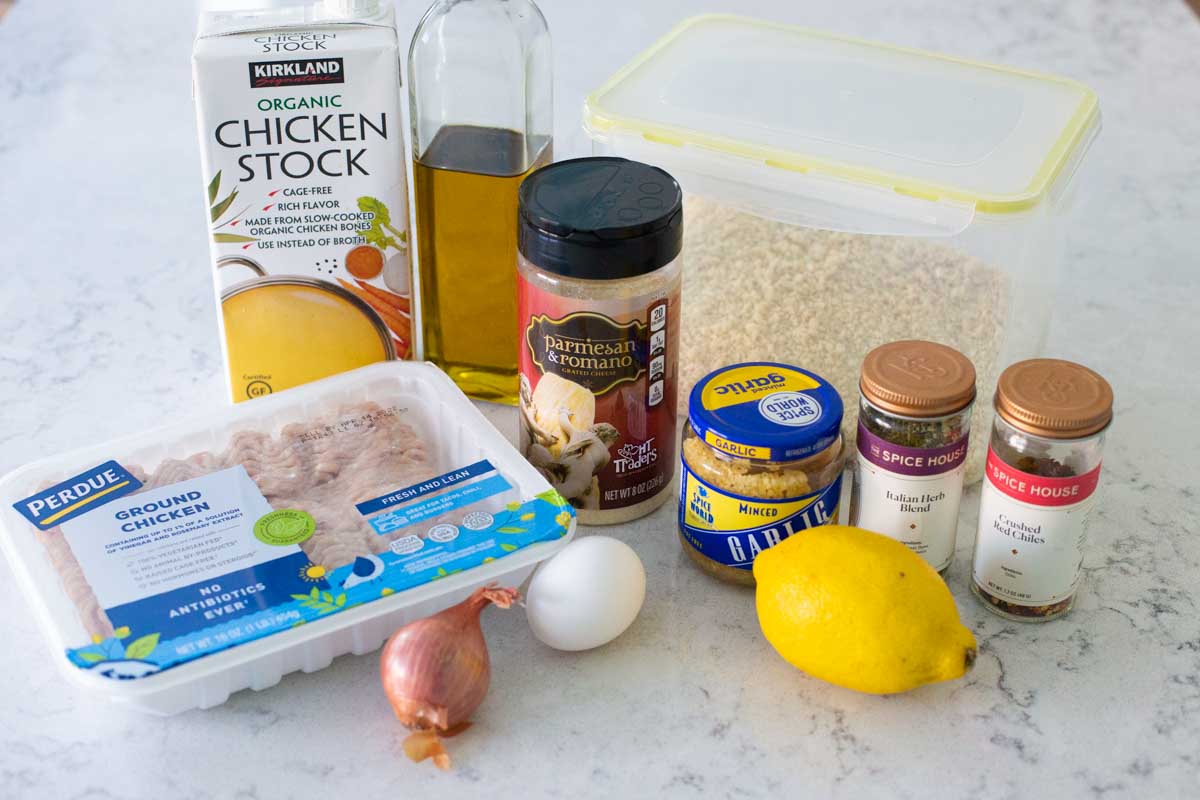 The ingredients to make chicken romano meatballs are on the counter.