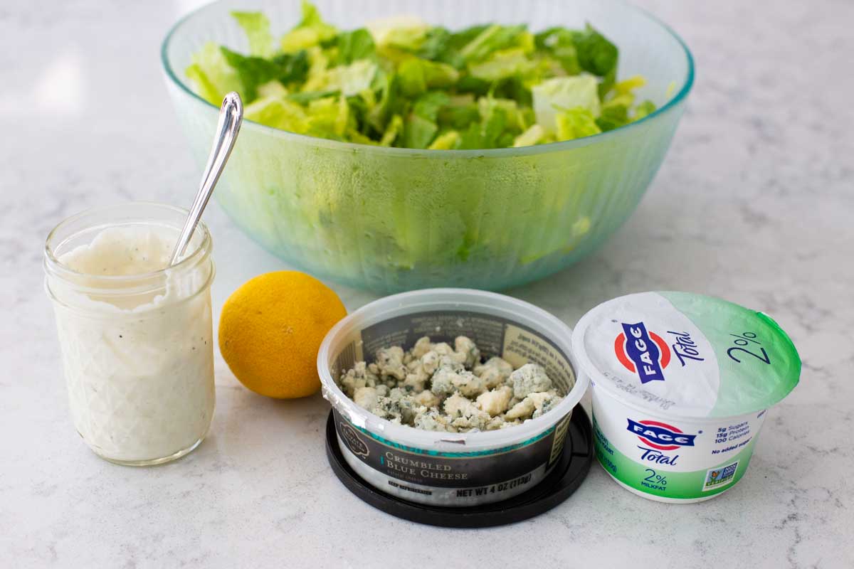 The ingredients to make a lighter blue cheese dressing sit on the counter.
