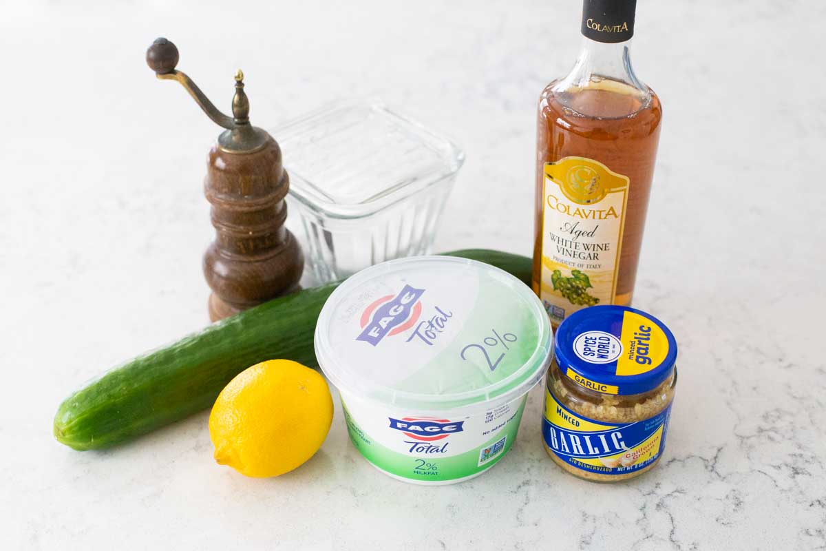 The ingredients to make homemade tzatziki are on the counter.