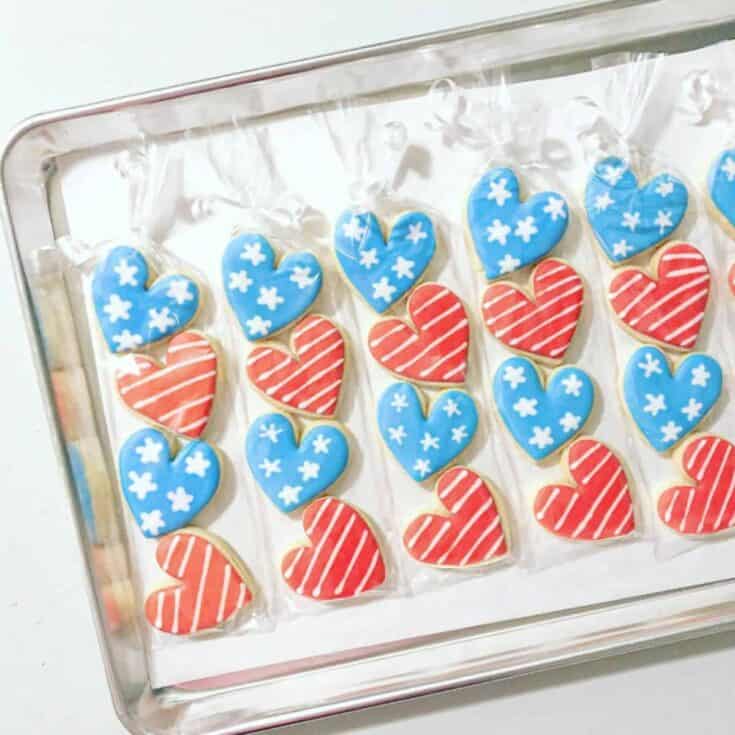 A sugar cookie tray of red and blue hearts.