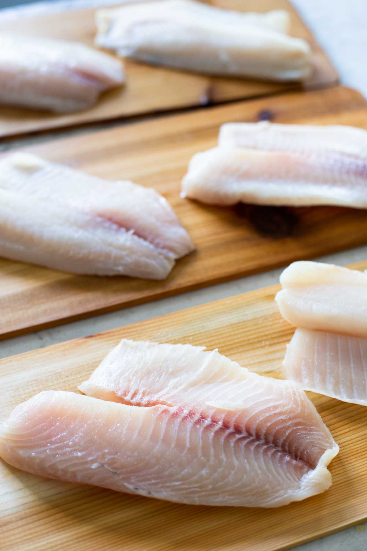 The raw fresh tilapia is waiting to be prepared.