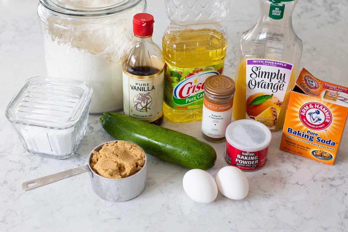 All the ingredients to make homemade zucchini bread are on the counter.