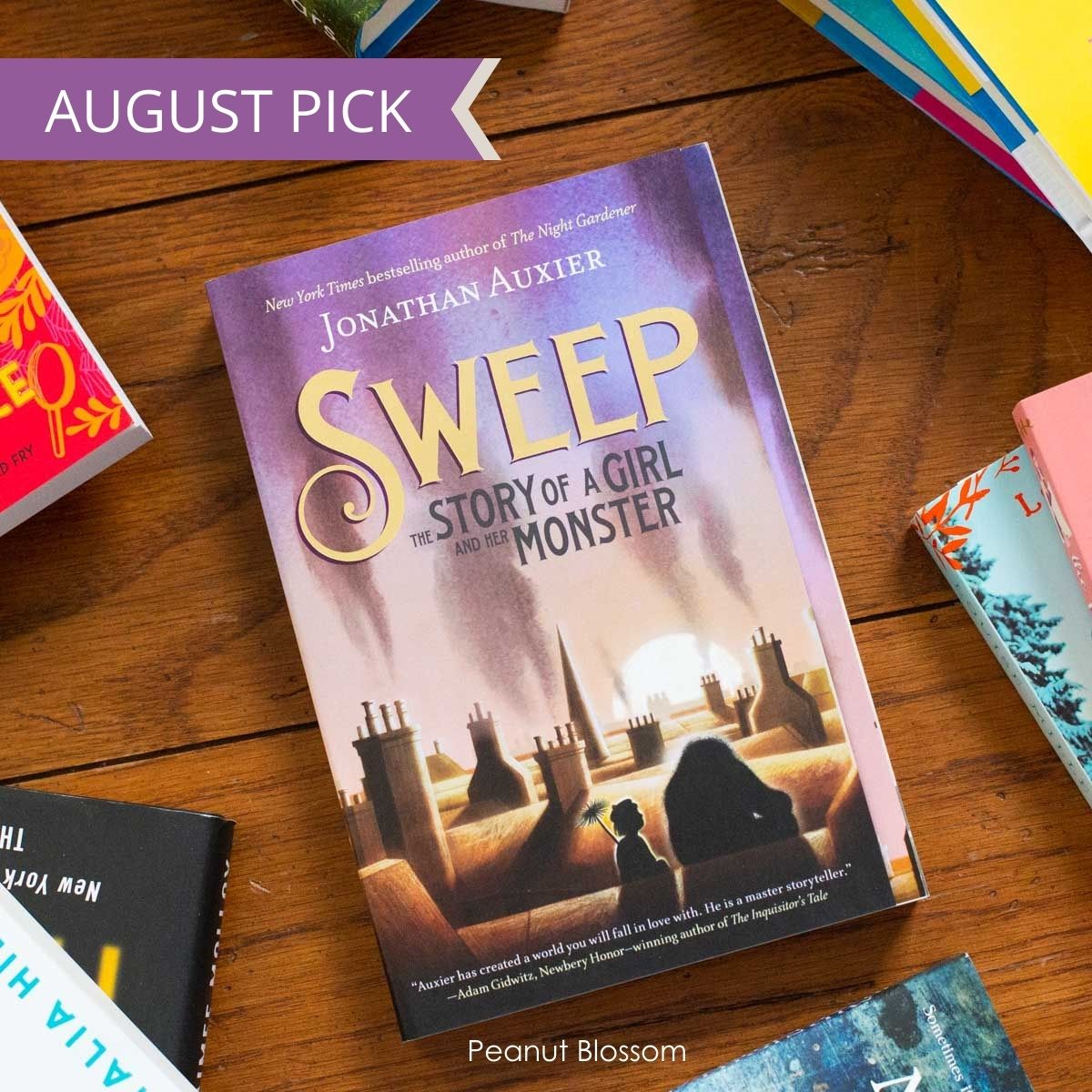 A copy of Sweet by Jonathan Auxier is on the table.
