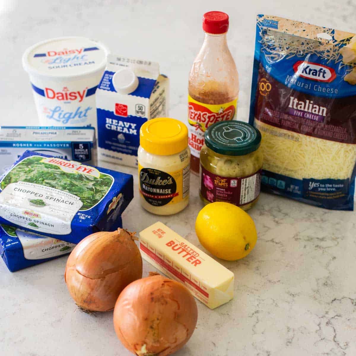 The ingredients to make caramelized onion dip are on the counter.