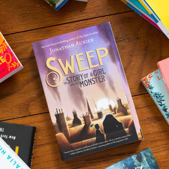 A copy of Sweep by Jonathan Auxier is on the table.