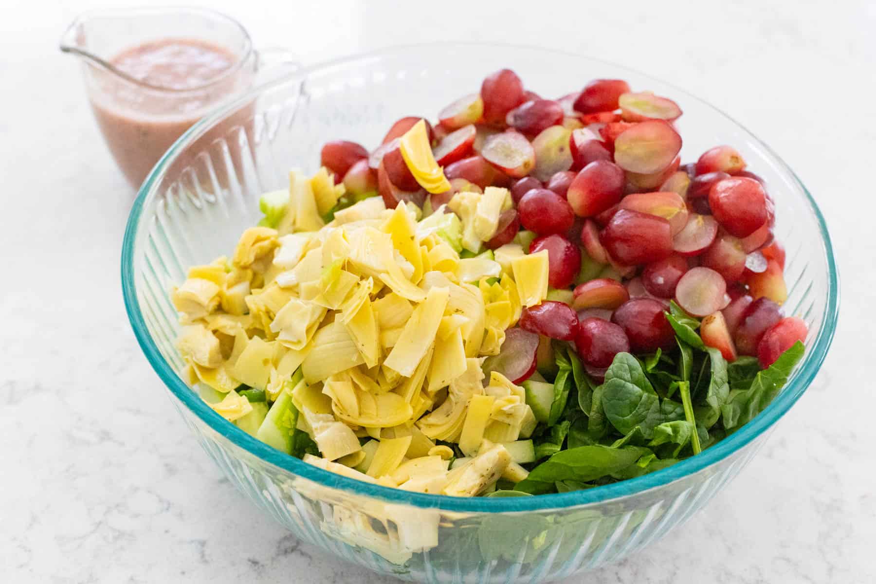 The vegetables for the salad in a large mixing bowl.