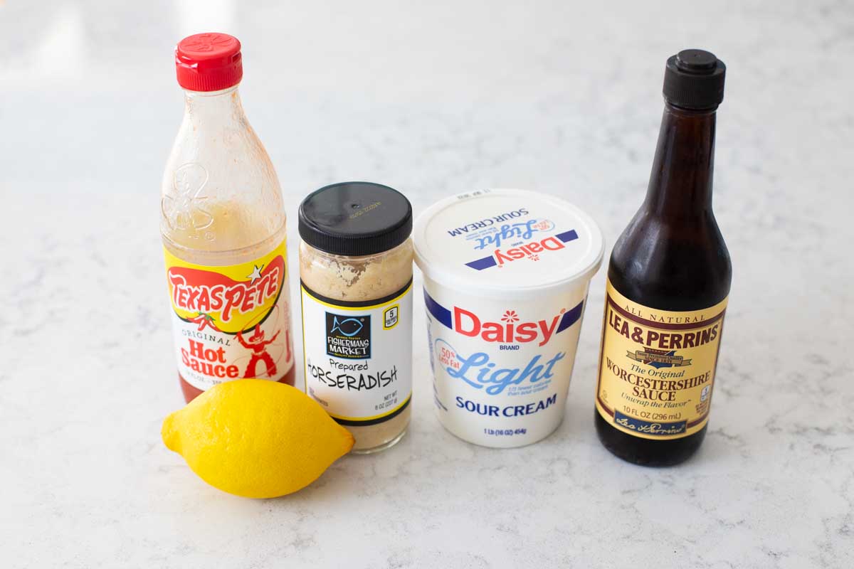 The ingredients to make homemade horseradish sauce are on the counter.