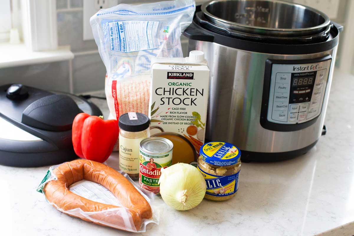 The ingredients to make an easy Instant Pot sausage and rice are on the counter.