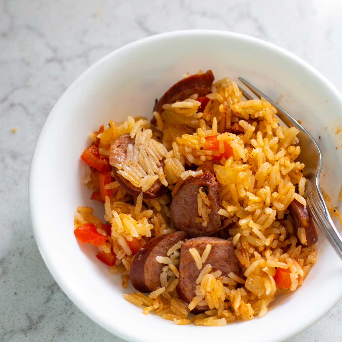 A bowl of Instant Pot sausage and rice.