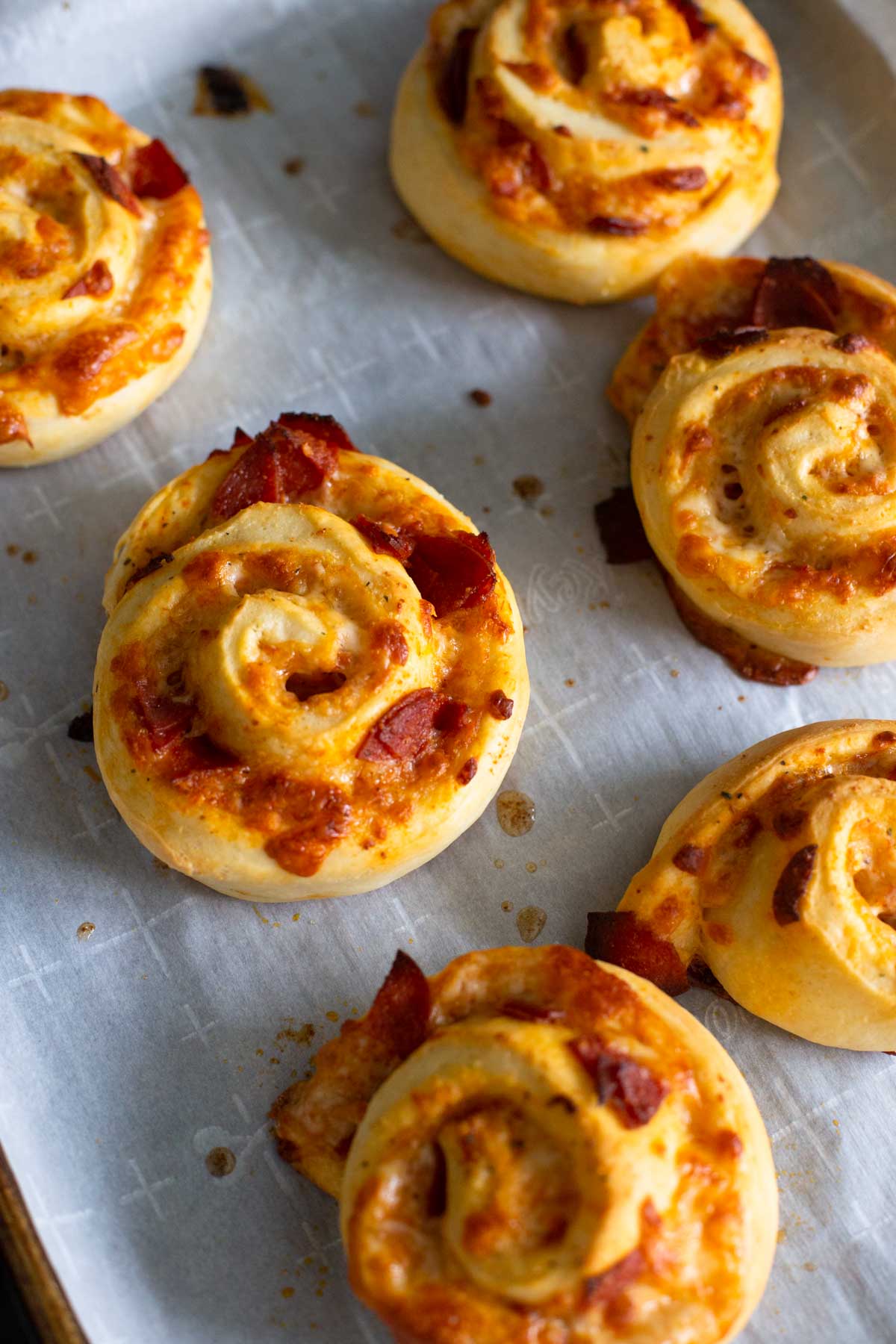 The pizza buns are golden brown and crispy looking.