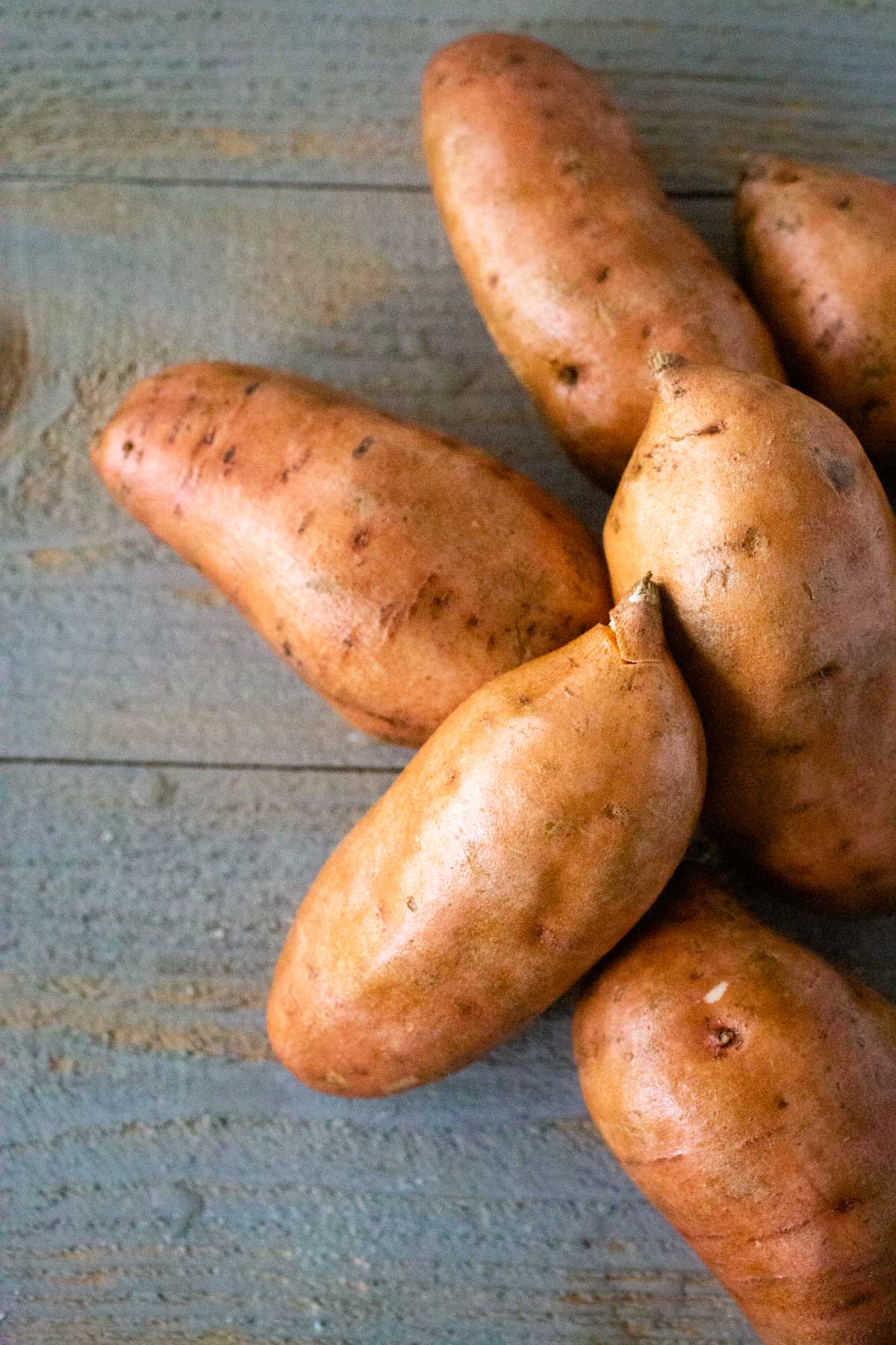 A pile of sweet potatoes ready to be baked.