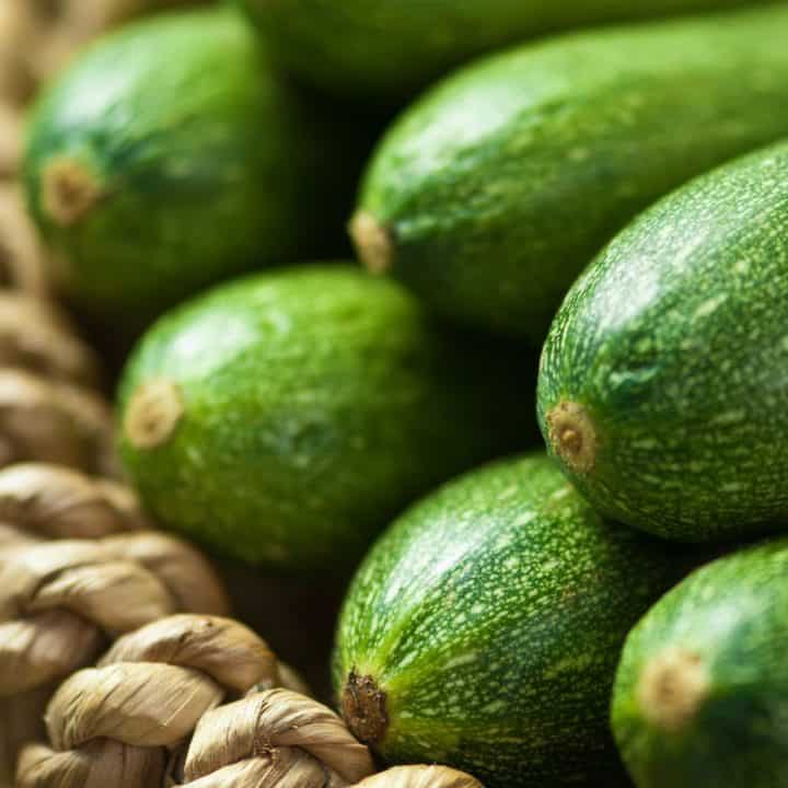 A basket filled with fresh zucchini.