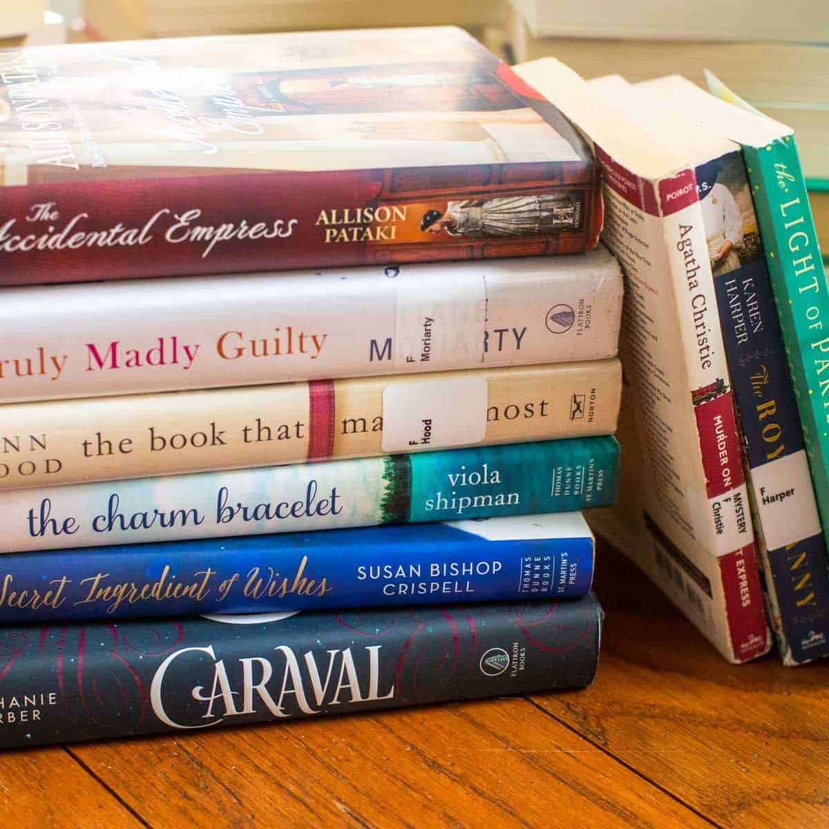 A pile of book club books.