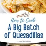 A sheet pan of several quesadillas is ready to keep warm in the oven.