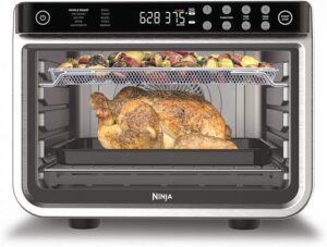 The convection oven has a whole chicken inside.
