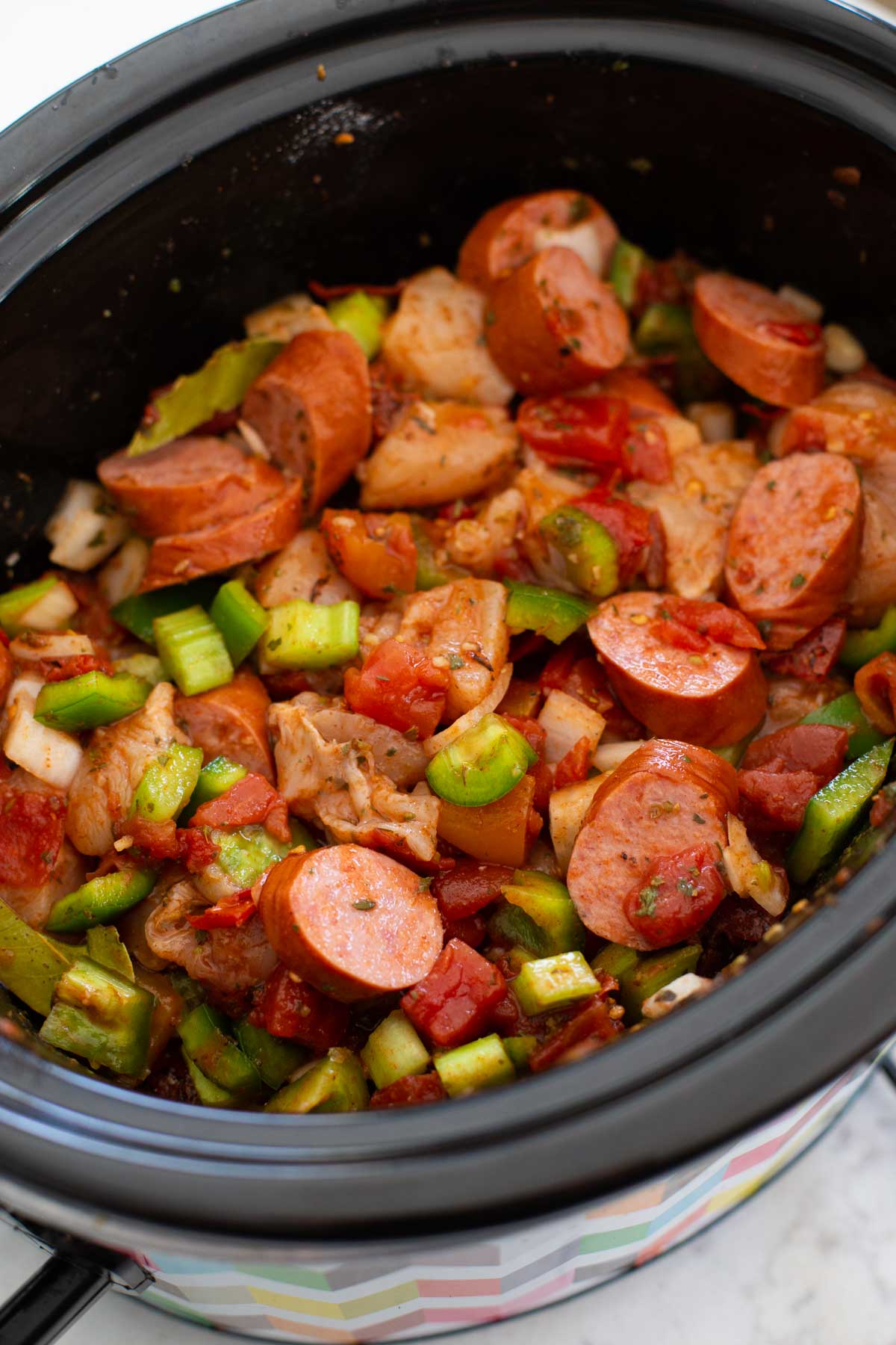 The chopped chicken and sausage are mixed in to cook longer than the shrimp.