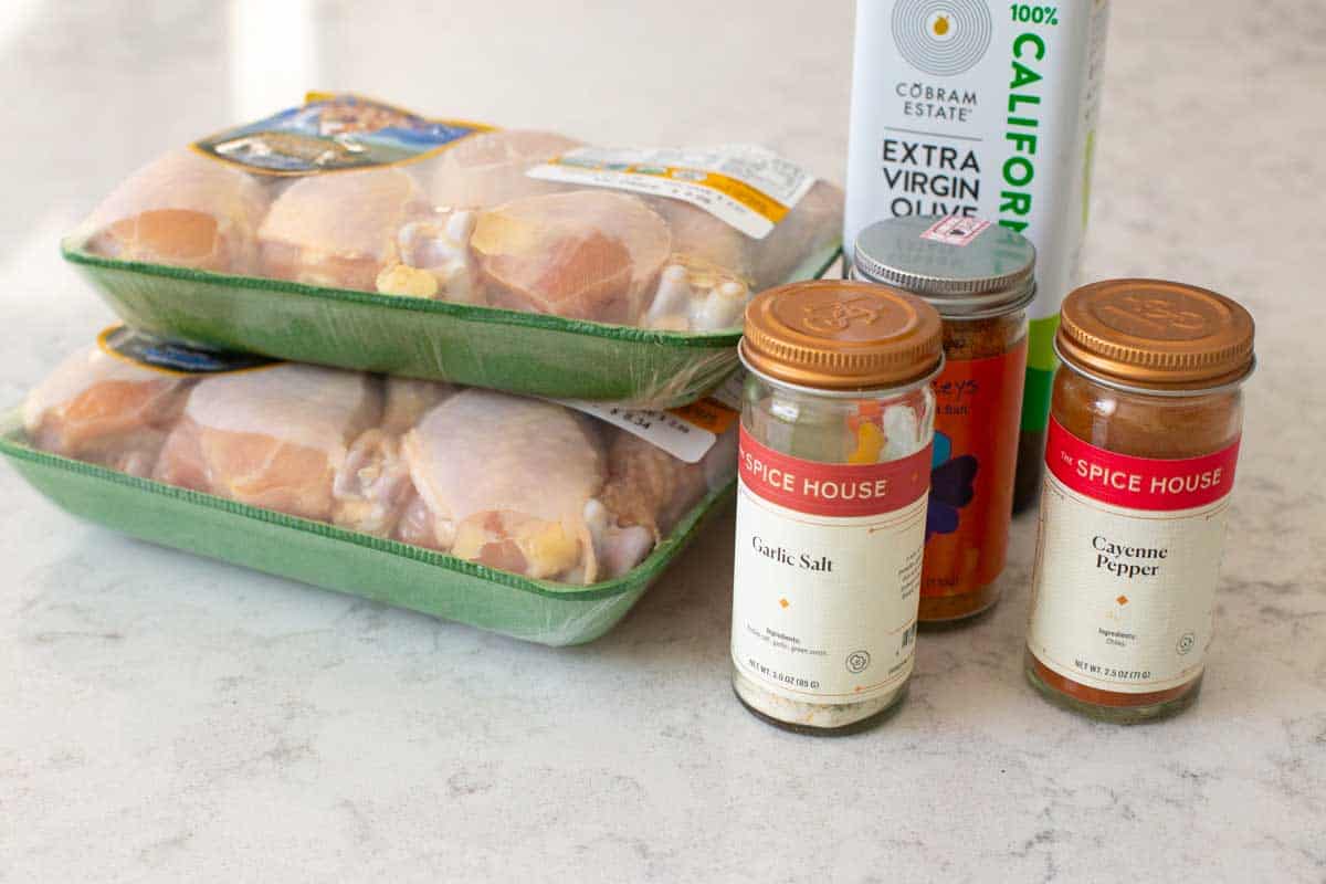 The ingredients to make the baked chicken legs are on the counter.